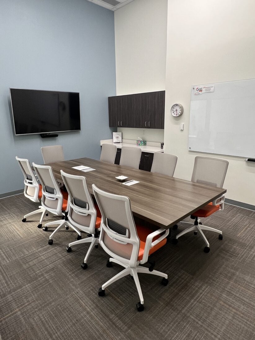 Modern office conference room with meeting table and ergonomic chairs at Office Evolution.