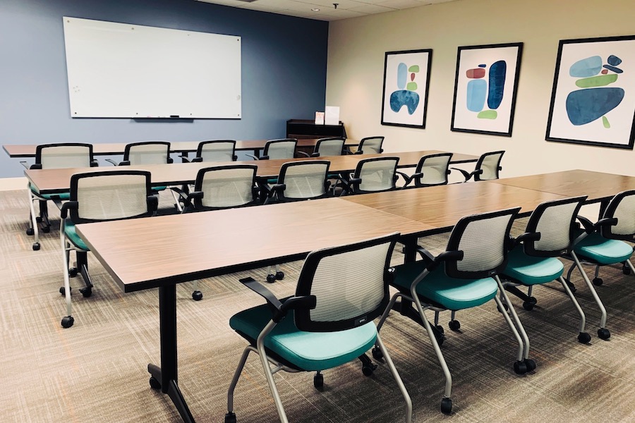 Brown conference room arranged classroom style.