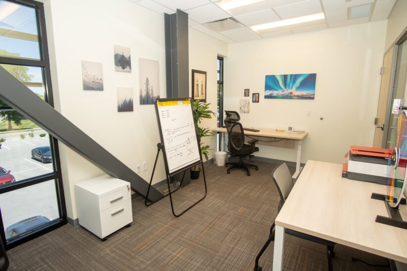 Flexible office workspace at Office Evolution with modern furniture and inspiring decor.