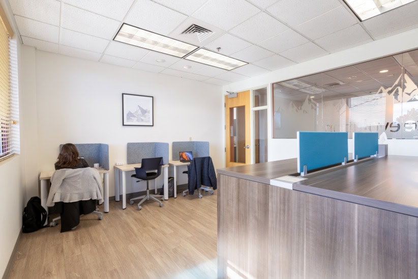Modern coworking space at Office Evolution Louisville with seating areas.