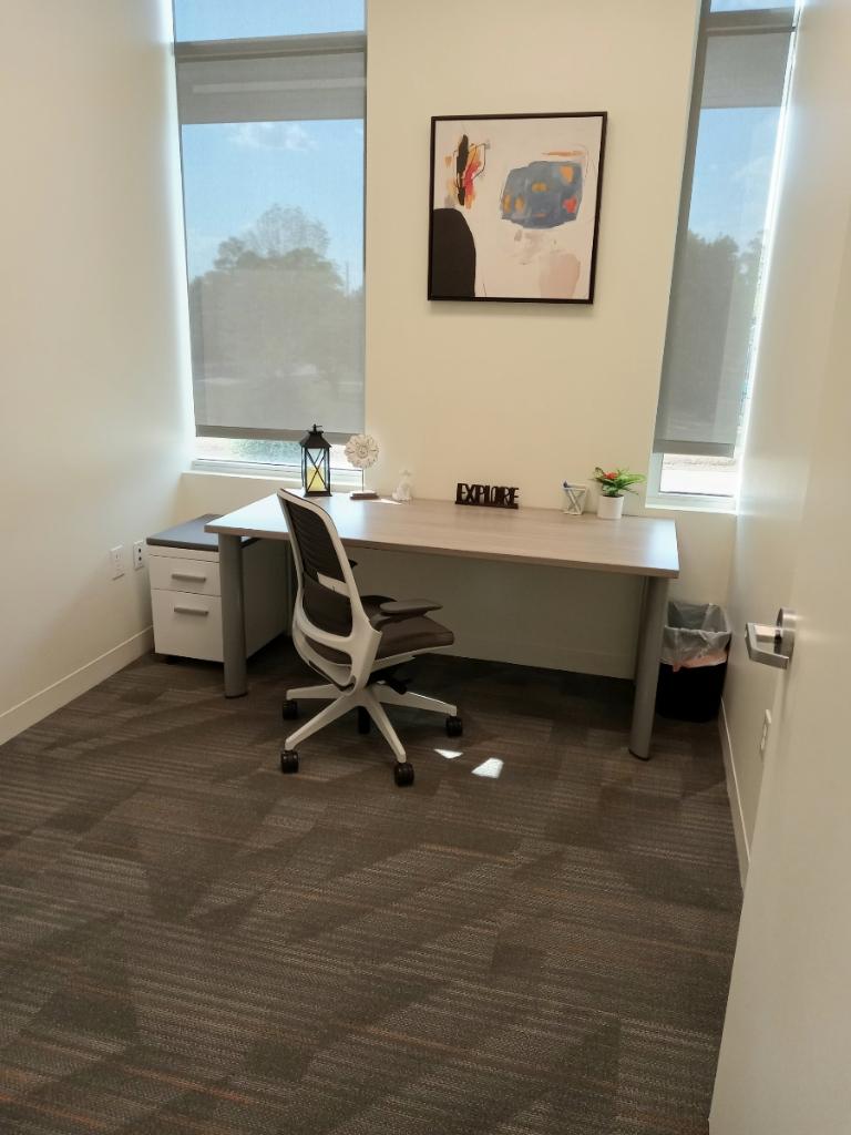 Modern office workspace with a sleek desk and ergonomic chair at Office Evolution.