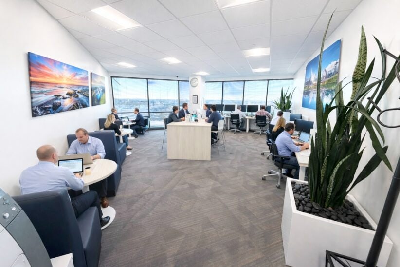 Modern shared office space with panoramic city views at Office Evolution for remote work and meetings.