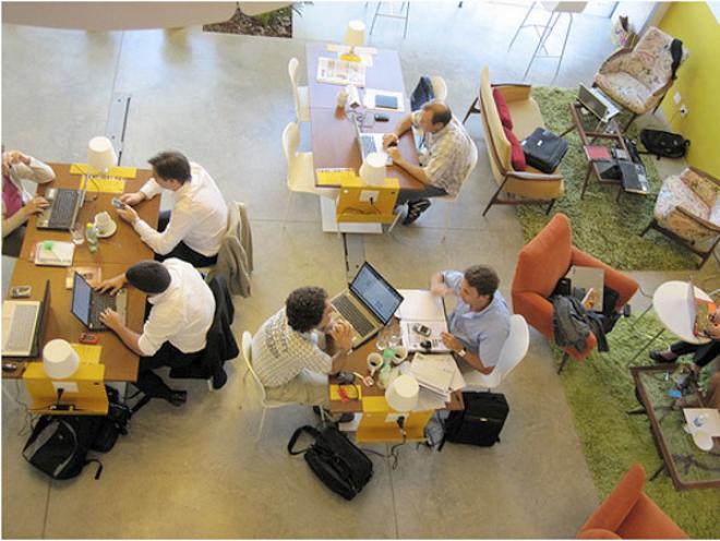 Coworking space with people all working on computers