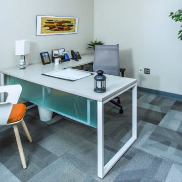 A private office with an orange chair