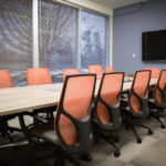 Members using meeting room at Office Evolution Charlotte