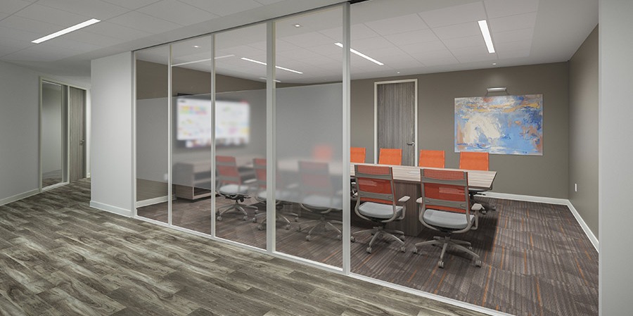 Conference room with a glass sliding door and orange chairs.