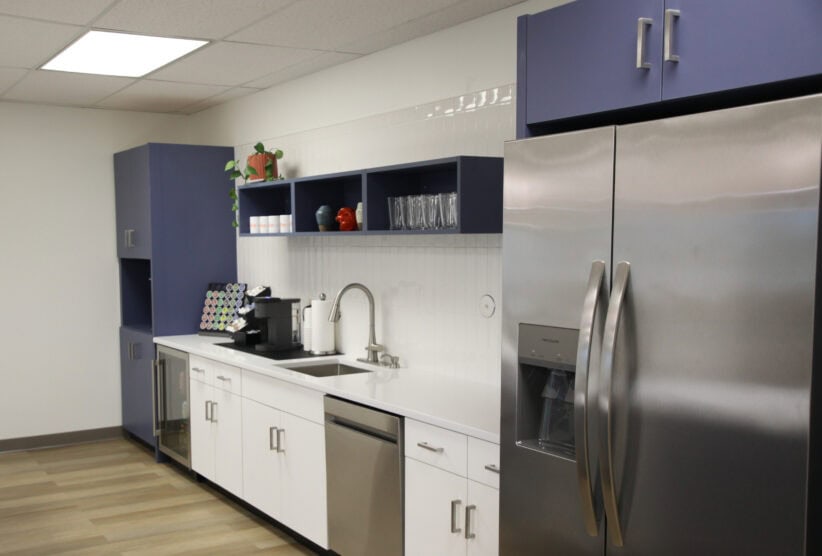 Office evolution modern office coffee station and kitchenette for remote work or meetings.