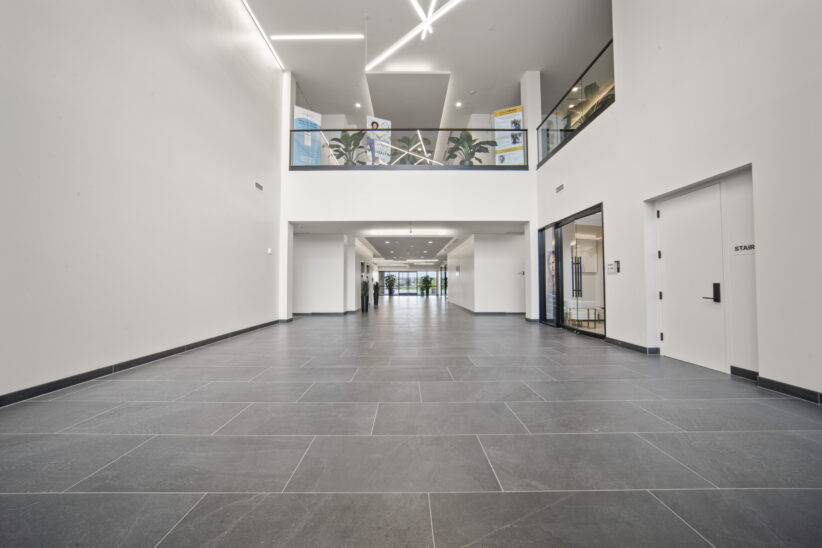 Spacious modern office lobby with sleek design and natural lighting at Office Evolution.