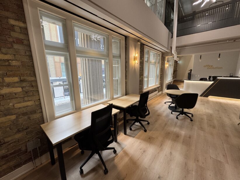 Bright, professional Toronto office environment featuring flexible coworking desks and inviting decor.