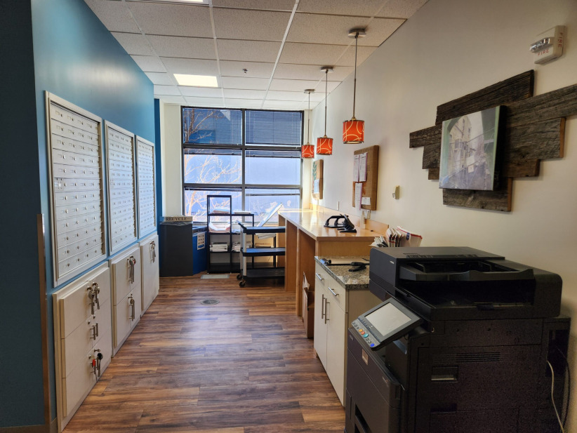 Lockers and reception area at Office Evolution coworking space.