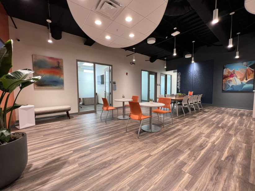Modern coworking space with bright lighting and colorful decor at Office Evolution.
