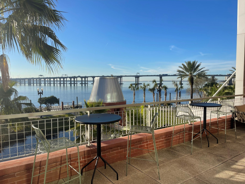Office space with waterfront view and outdoor seating at Office Evolution.