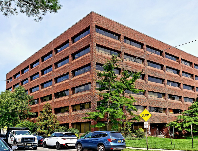 Office evolution coworking space exterior building office rentals urban office environment.