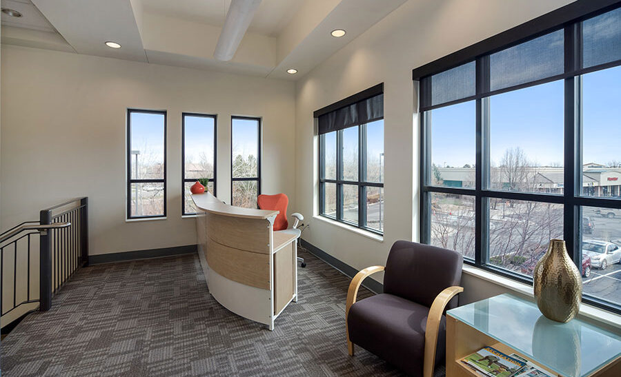 Modern office reception area with large windows and seating options, ideal for flexibility and professional workspace, Office Evolution.