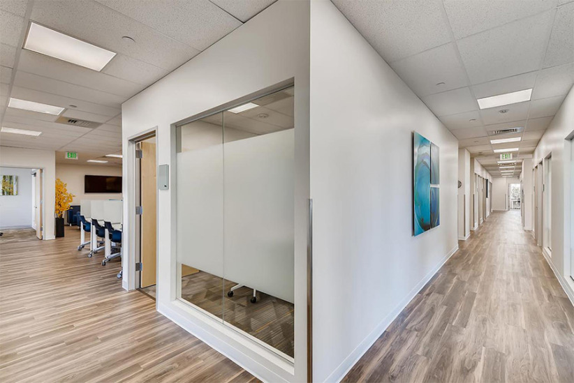 Modern office interior with meeting rooms and collaborative workspace at Office Evolution.