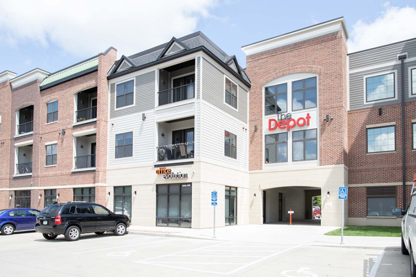 Office Evolution coworking space with flexible office rentals and meeting rooms in a modern building.