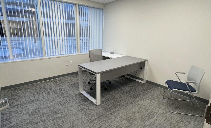 Modern private office space with desk and chairs at Office Evolution. Perfect for remote work, meetings, or private business offices.