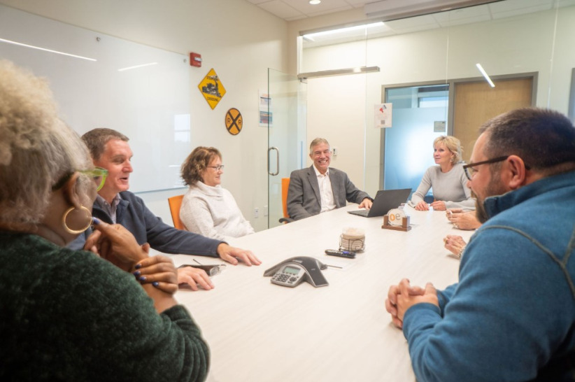 Friendly business meeting in modern shared office space at Office Evolution.