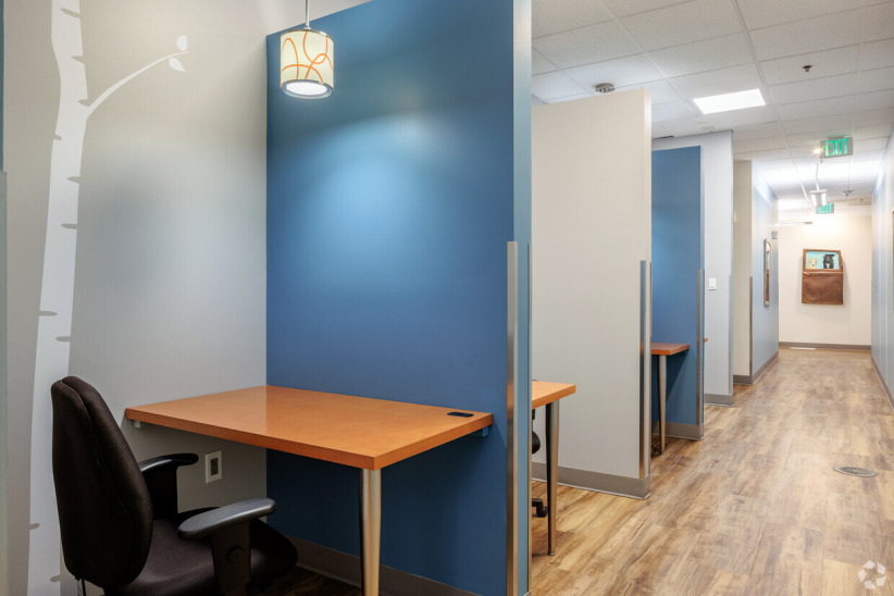 Quiet private office booth with desk and chair at Office Evolution coworking space.
