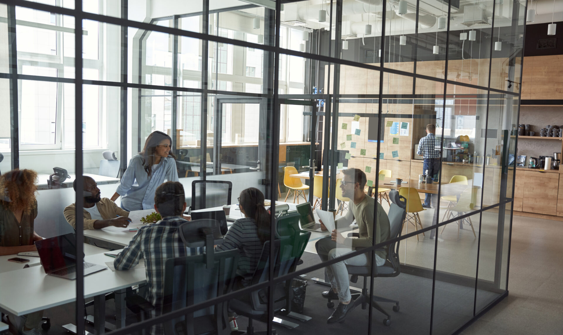 Office evolution coworking space modern office interior with diverse team collaborating.