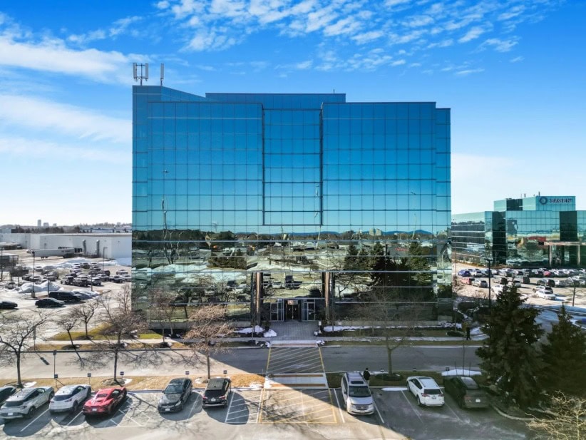 Office Evolution Oakville coworking space with modern glass building.