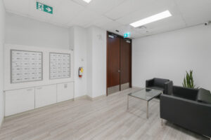 Modern office lobby with mailboxes and seating in Oakville.