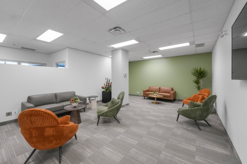 Office Evolution Oakville coworking lounge with modern seating and vibrant decor.