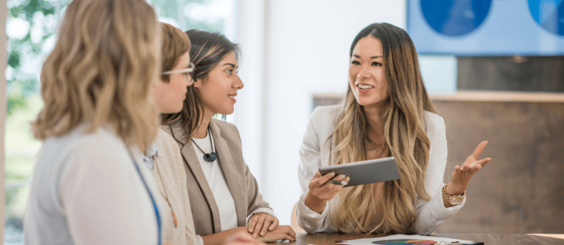 Businesswomen collaborating in a modern coworking space for small business growth.