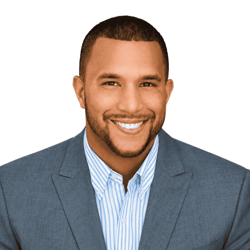 Professional man in a suit smiling for a corporate headshot.