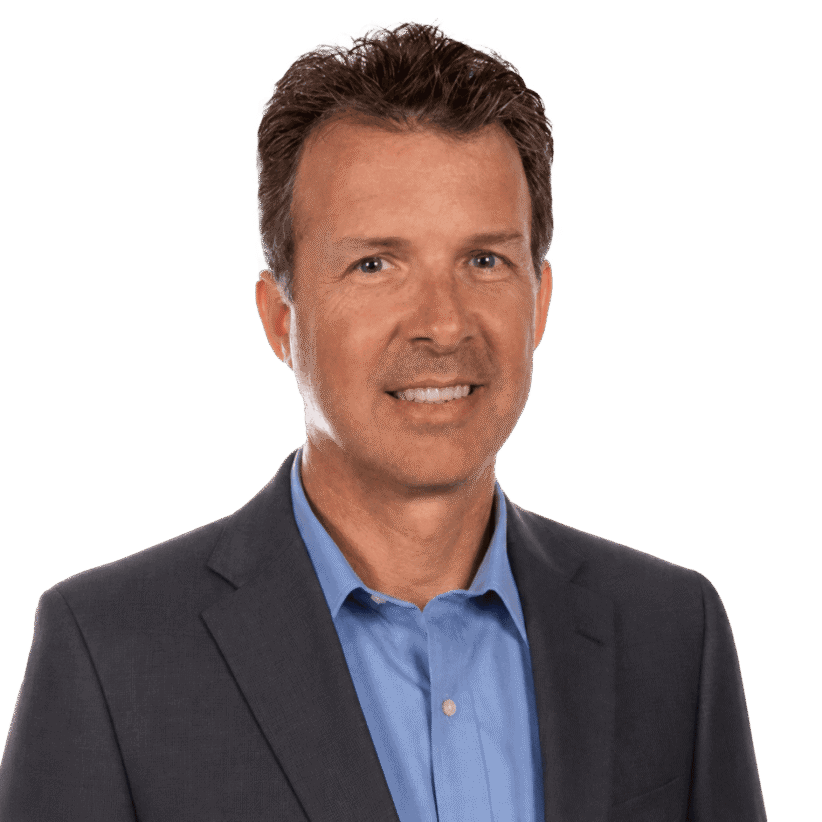 Professional man in a suit smiling for the camera.
