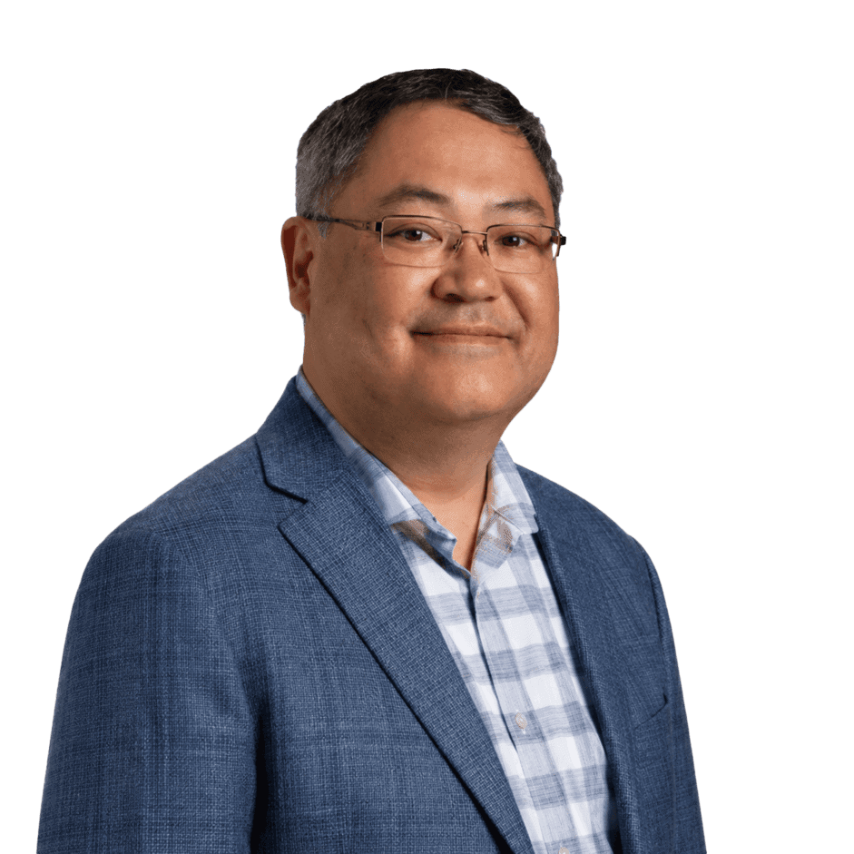 Professional man in business attire smiling for corporate portrait.